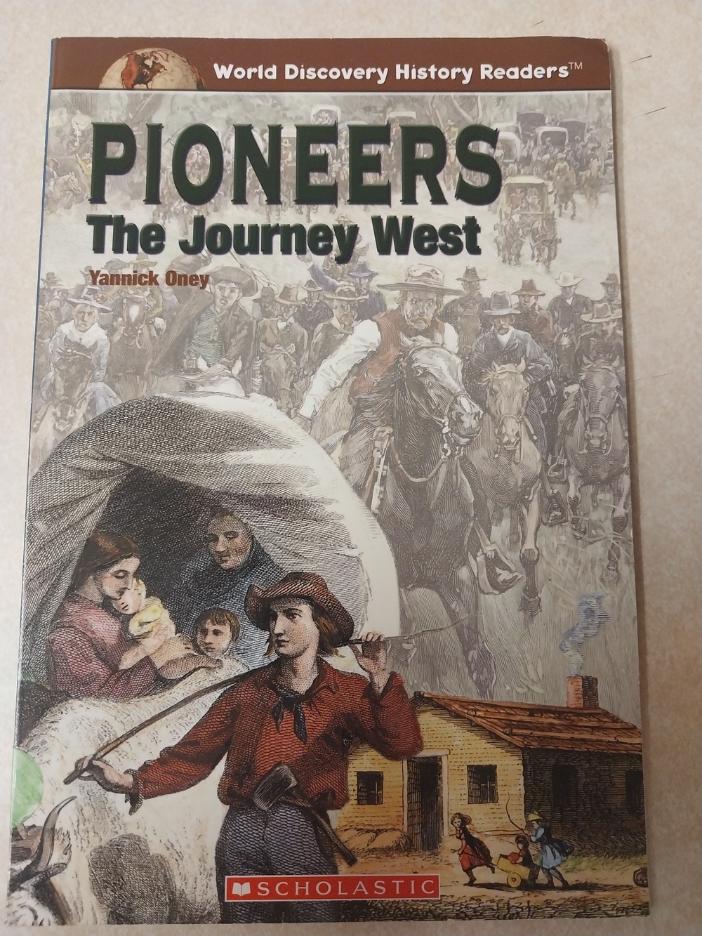 Scholastic Pioneers History Reader — Green and Brown Illustrated Cover
